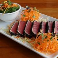 Tuna Tataki · Lightly seared tuna coated with roasted black sesame & pepper. Served w. seaweed salad and a...