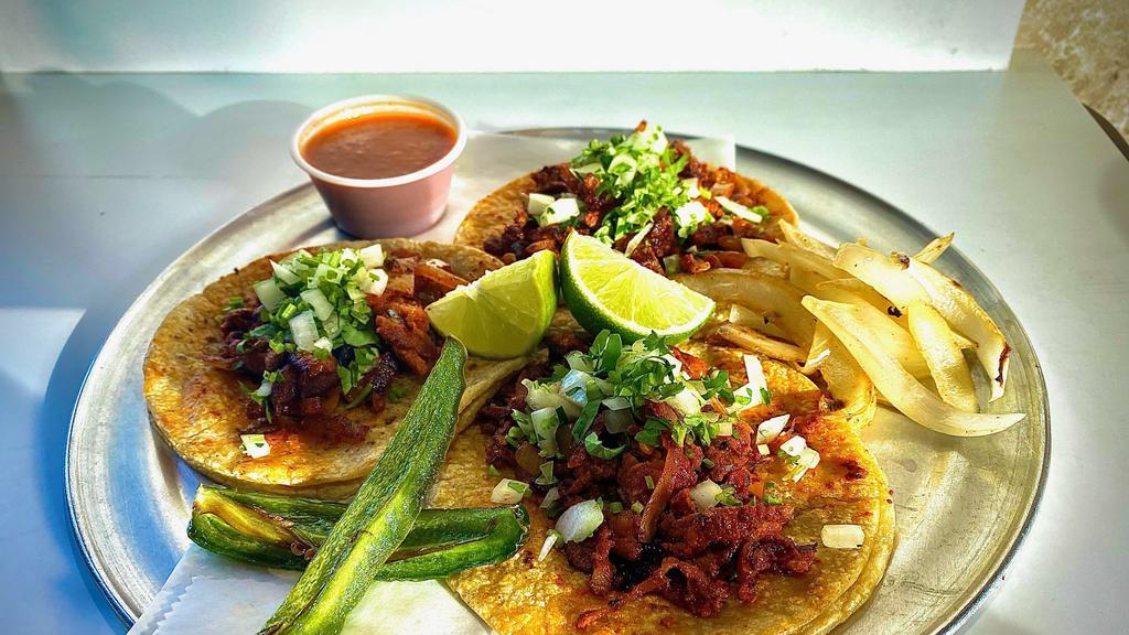 Tacos · Corn or flour tortilla served with your choice of meat topped with onions and cilantro. Add rice and beans on the side for an extra charge. Cheese on top for an extra charge.