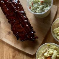 Full Rack Of Ribs Meal · A full rack of BBQ ribs. Comes with mashed potatoes, coleslaw, dinner bread, and chicken dum...