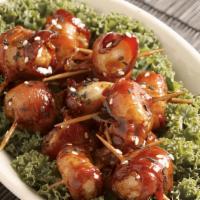 Bacon Wrapped Water Chestnuts · Crunchy water chestnuts wrapped in bacon tossed in a light oriental glaze and topped with se...