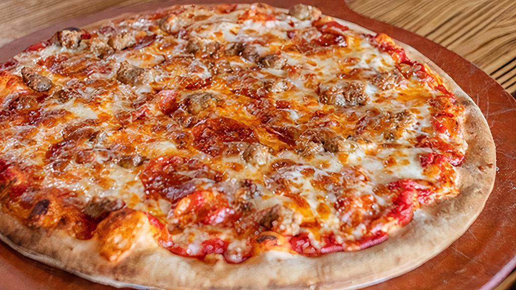The Meat Lover · Our red sauce topped with Mozzarella cheese, pepperoni, Canadian bacon, sausage, diced ham, chopped bacon, and ground beef.