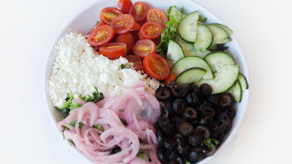Greek Salad · Mixed greens, grape tomatoes, cucumbers, pickled onions, black olives, feta cheese, and Greek vinaigrette.
