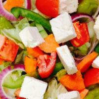 Greek Salad · Vegan and Gluten Free.  greens, tomato, cucumber, onion, peppers, feta, olives & red wine vi...