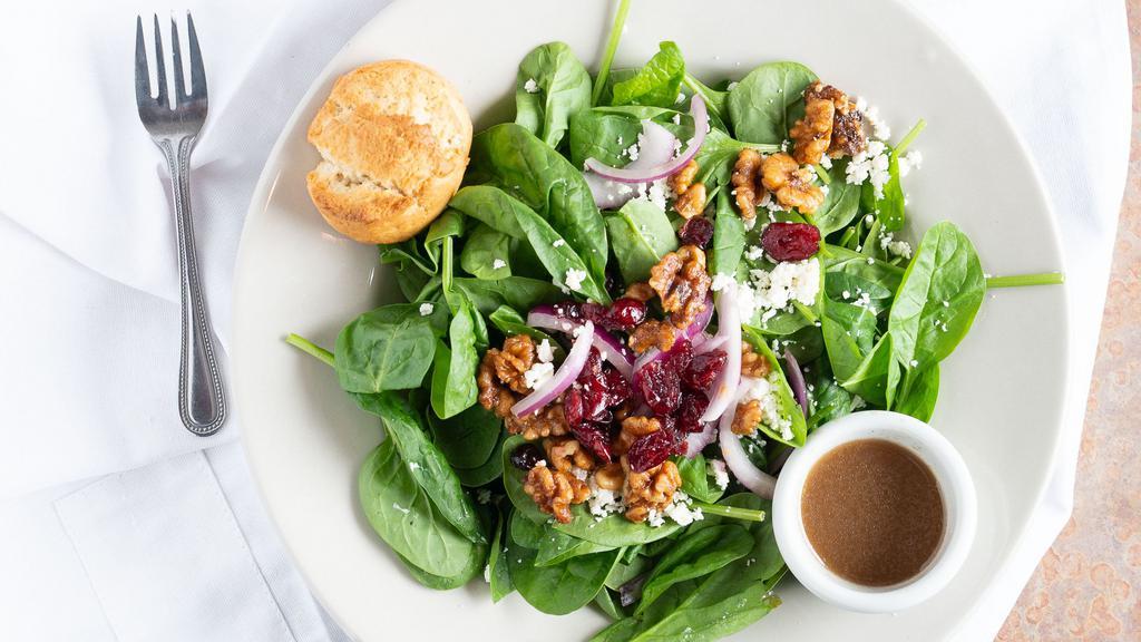 Spinach Salad · Spinach, feta cheese, dried cranberries,
candied walnuts, onion & balsamic vinaigrette dressing.