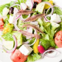 Grecian Salad · Crispy romaine, tomatoes, Kalamata black olives, anchovies, Feta cheese, red onions, bell pe...