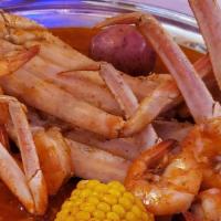 Crab Hut Combo · Includes: 1 lb snow crab, 1 lb clam, 1/2 lb shrimp, one corn, one egg, one potato, sausage.