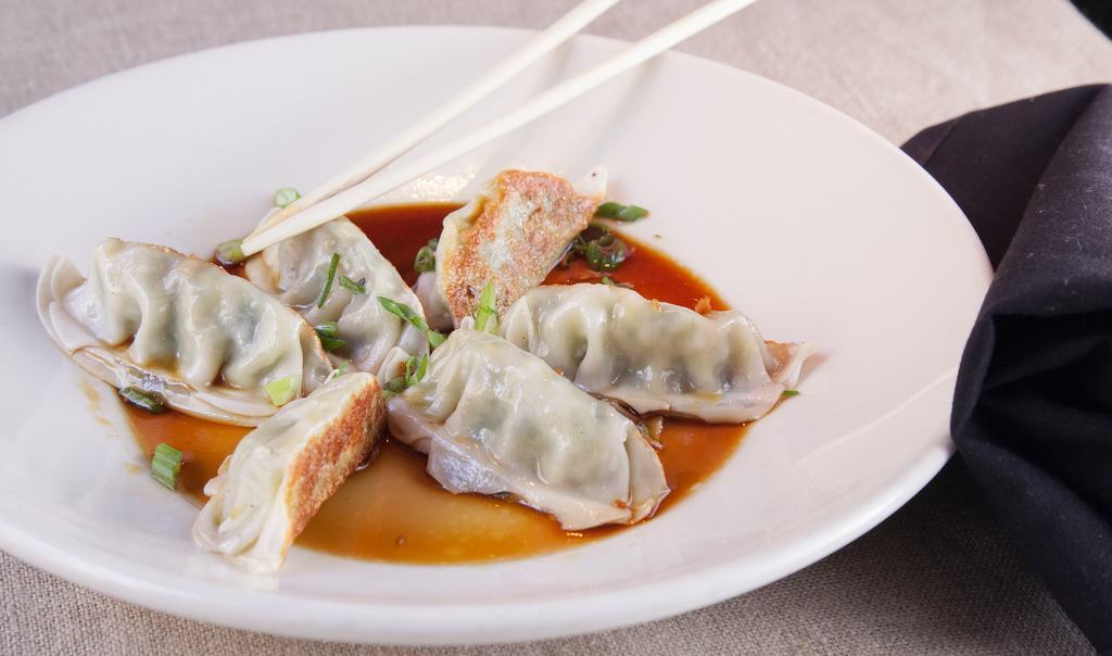 Chicken Dumplings (6) · Served with ginger-soy dipping sauce.