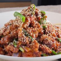 Sesame Chicken · Sesame-crusted chicken, red onions, scallions.