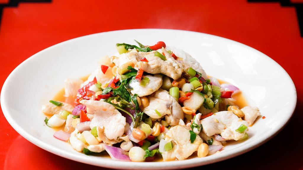 Thai Hot Pepper Chicken · Spicy. Fresno peppers, Thai basil, peanuts, red onions, cilantro, tangy lemon sauce