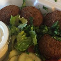 Falafel Appetizer · Fried chickpeas and veggies patties. Served with tahini and pita. Five pieces.