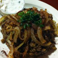 Mujaddara · Lentils and cracked wheat cooked in onion and olive oil sauce topped with caramelized onions...