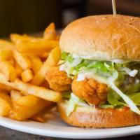 Crispy Chicken Burger · Deep-fried chicken tender, Swiss cheese, lettuce, tomatoes, pickles, and mayo.