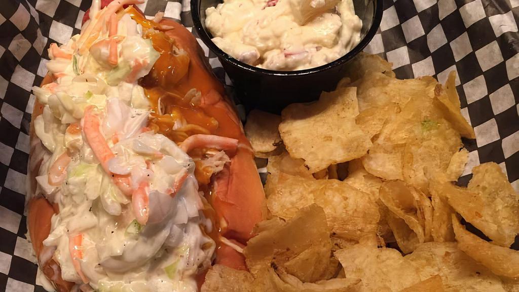 The Carolina · Pulled chicken, Carolina gold sauce, and coleslaw. Served with chips.