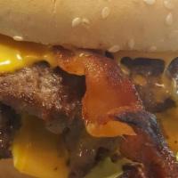 Double Bacon Cheeseburger · A customer favorite!  Bacon, cheese, 2 beef patties, onion, ketchup, mustard and pickles inc...