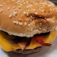 Bacon Cheeseburger · One beef patty with bacon and a slice of American Cheese.  Burger has ketchup, mustard, frie...