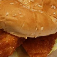 Fish Sandwich · Golden fried fish (cod) with tarter and lettuce.