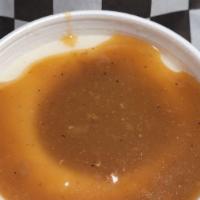 Mashed Potatoes & Gravy · Mashed potatoes served up hot with our signature gravy.