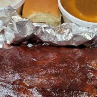 Bbq Rib Dinner · Slowly smoked pork ribs smothered in the Coop's tangy home-made barbecue sauce - meaty and t...