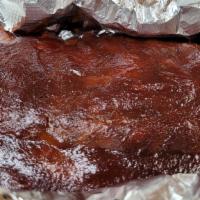 Bbq Ribs Only – No Sides · Slowly smoked pork ribs smothered in the Coop's tangy home-made barbecue sauce - meaty and t...