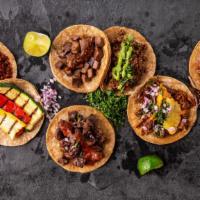 2 Taco Plate · With rice and beans.