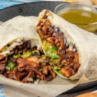 Al Pastor Burrito · Our famous marinated pork cooked on a vertical grill.