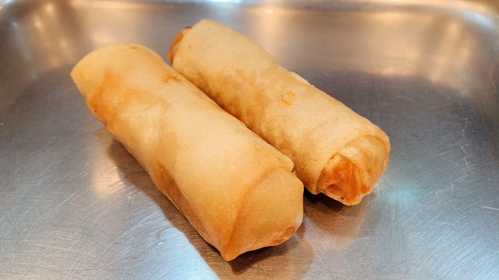 Veggie Spring Roll · Prepared with fresh cabbage wrapped in a thin wonton wrapper and cooked to a golden brown.