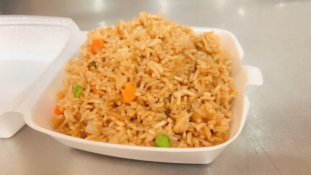 Fried Rice · prepared with steamed brown rice in soy sauce, greens peas, carrots and chopped onions.