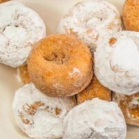 Mini Dozen Donuts · Enjoy these poppable donut treats! Available in Cinnamon Sugar, Powdered Sugar, or Plain.