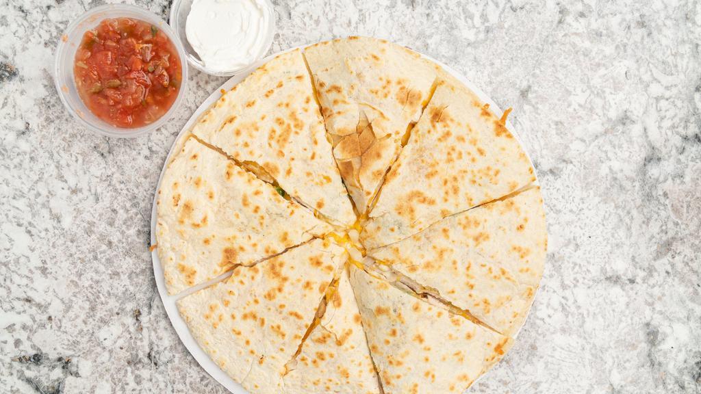 Chicken Quesadilla · Grilled chicken, green peppers, onions and cheddar jack cheese sandwiched between two flour tortillas. Served with homemade salsa and sour cream.