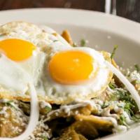 Chilaquiles · Served with a side of rice and beans. Fried tortilla strips, tomatillo sauce, scrambled eggs...