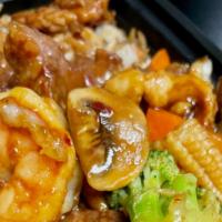 Hunan Triple Delight Lunch Special · Shrimp, chicken, and beef with broccoli, baby corn, carrots, and mushrooms in spicy hunan sa...