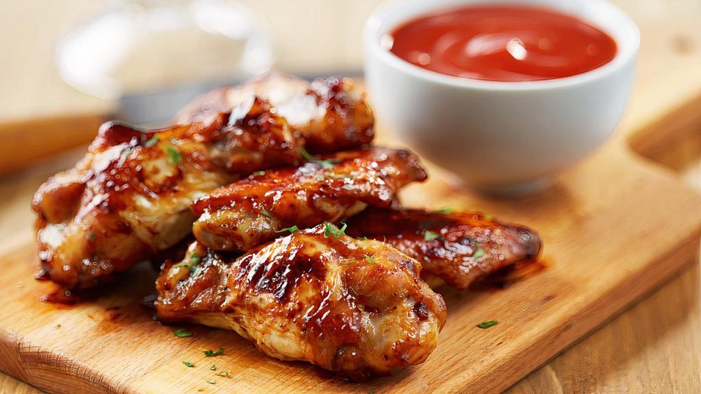 Bbq Wings (6) · Deep-fried wings with BBQ Sauce on top.