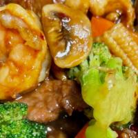 Hunan Triple Delight · Shrimp, chicken, and beef with broccoli. baby corn, carrots, and mushrooms in a spicy Hunan ...