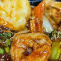 Four Season · Shrimp, scallops, beef, chicken and lots of mixed vegetables with brown sauce.