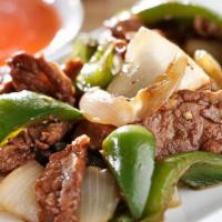 Pepper Steak · Flank steak with green peppers and onion in brown sauce.
