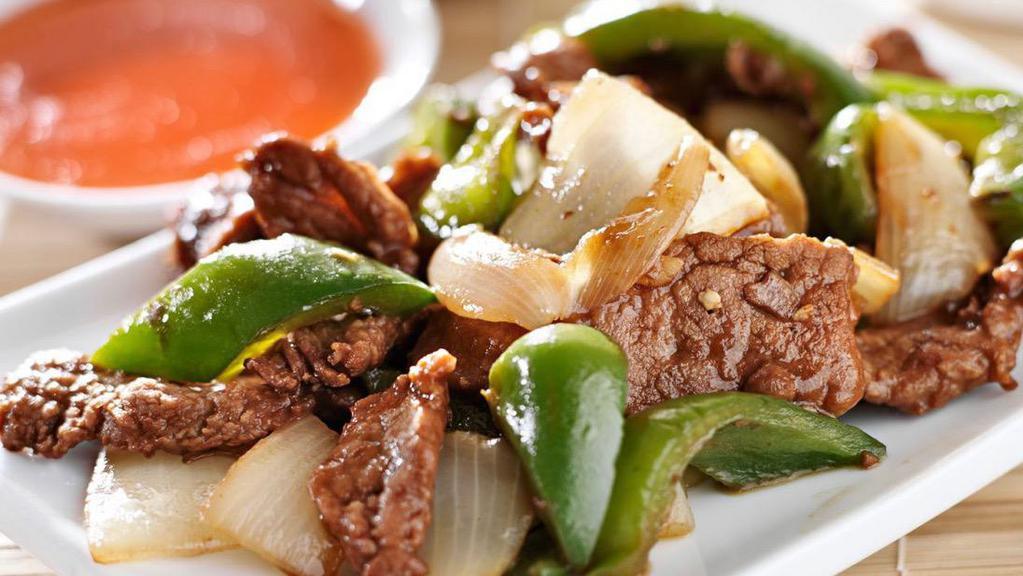 Pepper Steak · Flank steak with green peppers and onion in brown sauce.