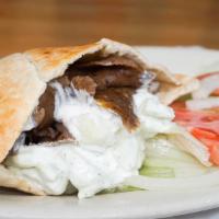 Gyros · Lamb and beef broiled on a rotisserie served in pita bread with your choice of our famous cu...