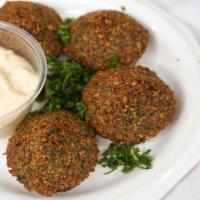 Falafel · Ground chick peas, onions and spices deep fried.