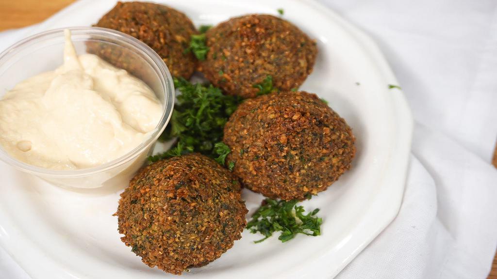 Falafel · Ground chick peas, onions, and spices deep fried served in pita bread with your choice of hummus-cucumber sauce-tahini sauce or sour cream.