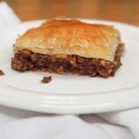 Baklava · Layers of pastry with walnuts and cinnamon topped with a sugary glaze.