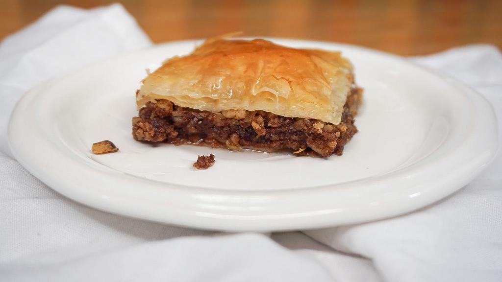 Baklava · Layers of pastry with walnuts and cinnamon topped with a sugary glaze.