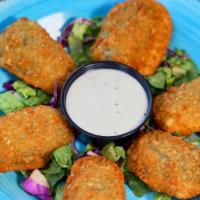 Jalapeño Poppers (7) · cream cheese breaded jalapeno, served with our house made ranch sauce.