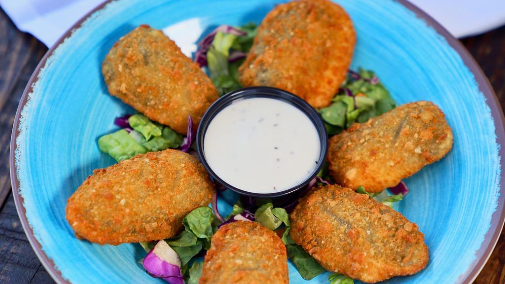 Jalapeño Poppers (7) · cream cheese breaded jalapeno, served with our house made ranch sauce.