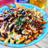 Loaded Brisket Fries · fresh cut fries, topped with 5oz smoked brisket, topped with our house made coleslaw, Korean...