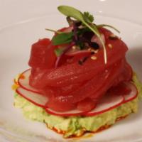 Tuna Ribbons* · Ahi tuna, avocado, radish, chili oil, and yuzu sesame dressing.