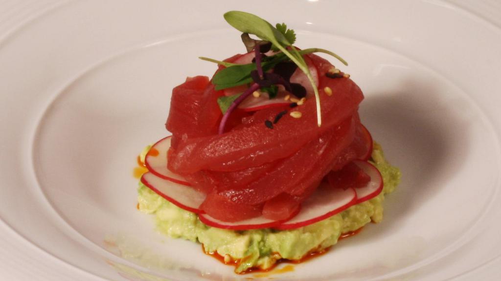 Tuna Ribbons* · Ahi tuna, avocado, radish, chili oil, and yuzu sesame dressing.