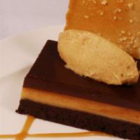 Torte · Flourless chocolate cake, chocolate ganache, peanut butter mousse, and vanilla tuile.