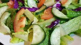 Small Garden Salad · Small garden salad with tomato, cucumber, cheese and dressing of your choice