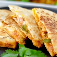 Chicken Quesadilla · Spicy chicken, peppers, onions and mixed cheese. Served with sour cream and salsa. (Vegetabl...