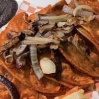 Tacos De Canasta Dinner · (Papa, mole rojo de pollo, frijoles, pollo picadillo con papas)served with Mexican rice & bl...